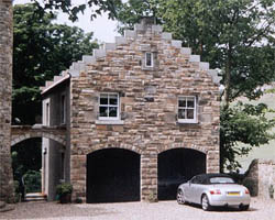 rubble wailing with arched garage doors